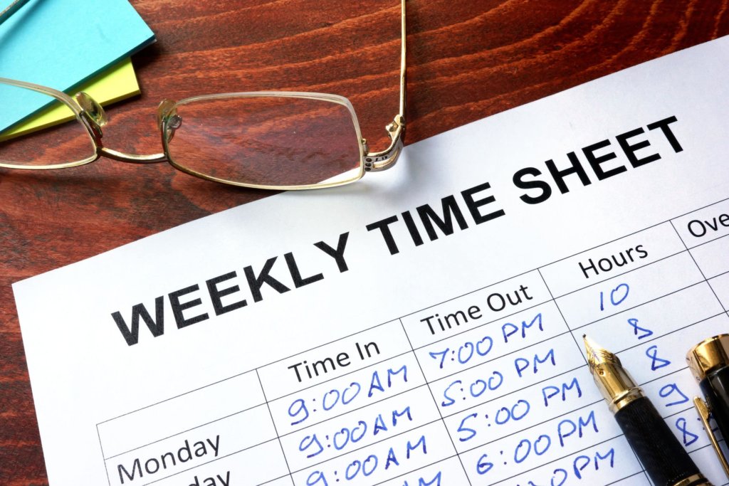 weekly hours time sheet with pen