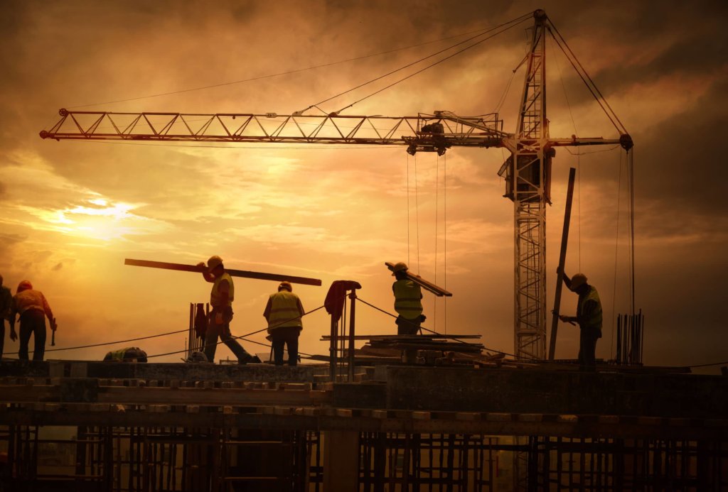 construction crew at sunset