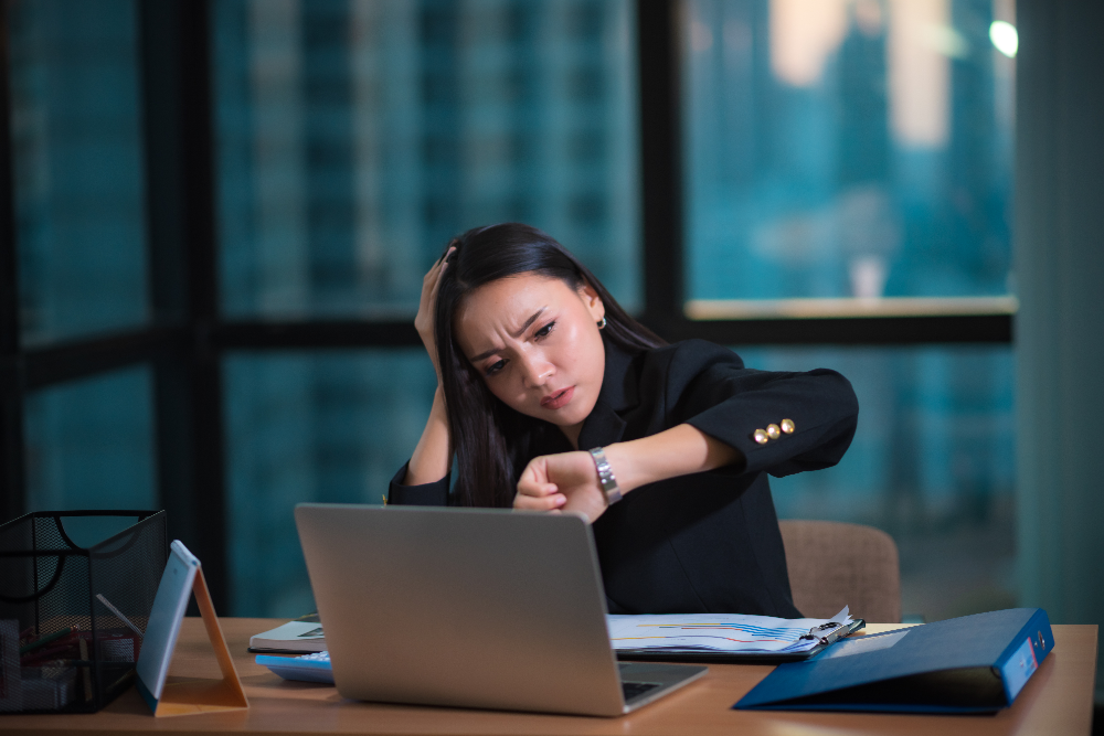 woman working over time in need of Houston Texas wage violation lawyer